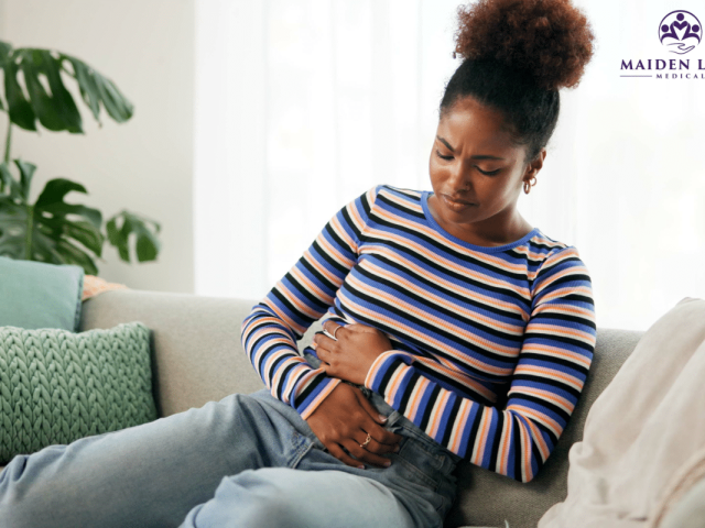 A woman in pain caused by Endometriosis in New York.