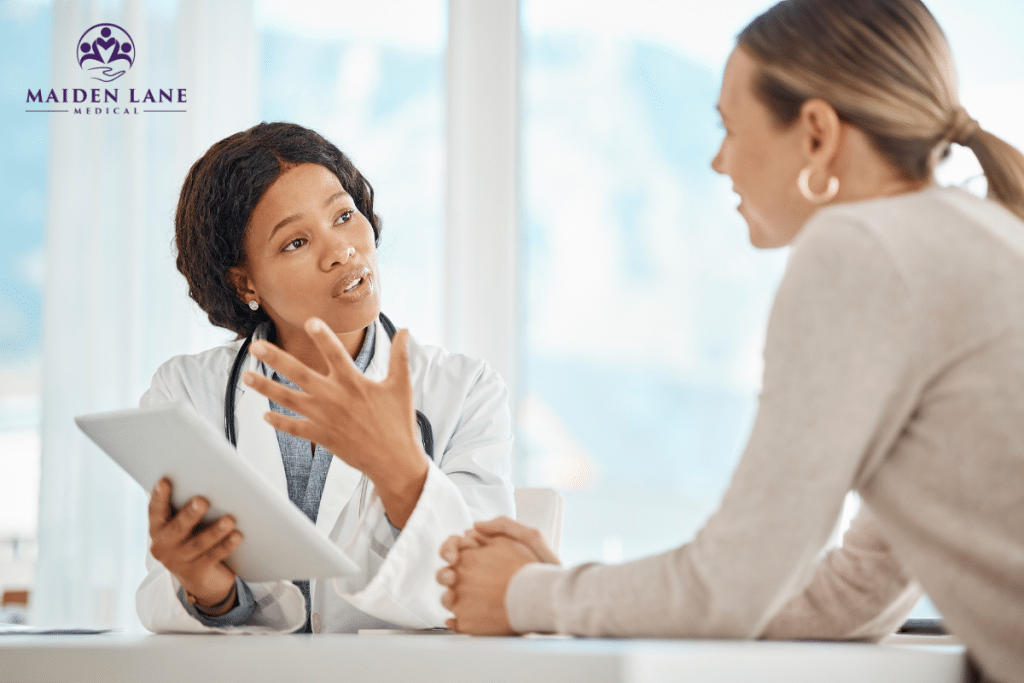 A woman at the doctor for a consultation to discuss the possible causes behind her occassional missed periods and how to address it in New York, Manhattan.