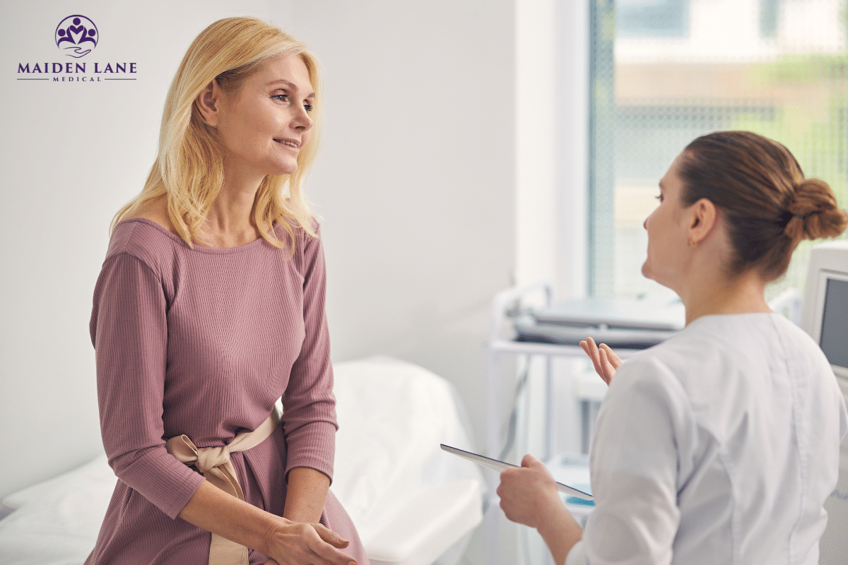 A woman with chronic pelvic pain consulting a doctor about uterus spasms in New York.