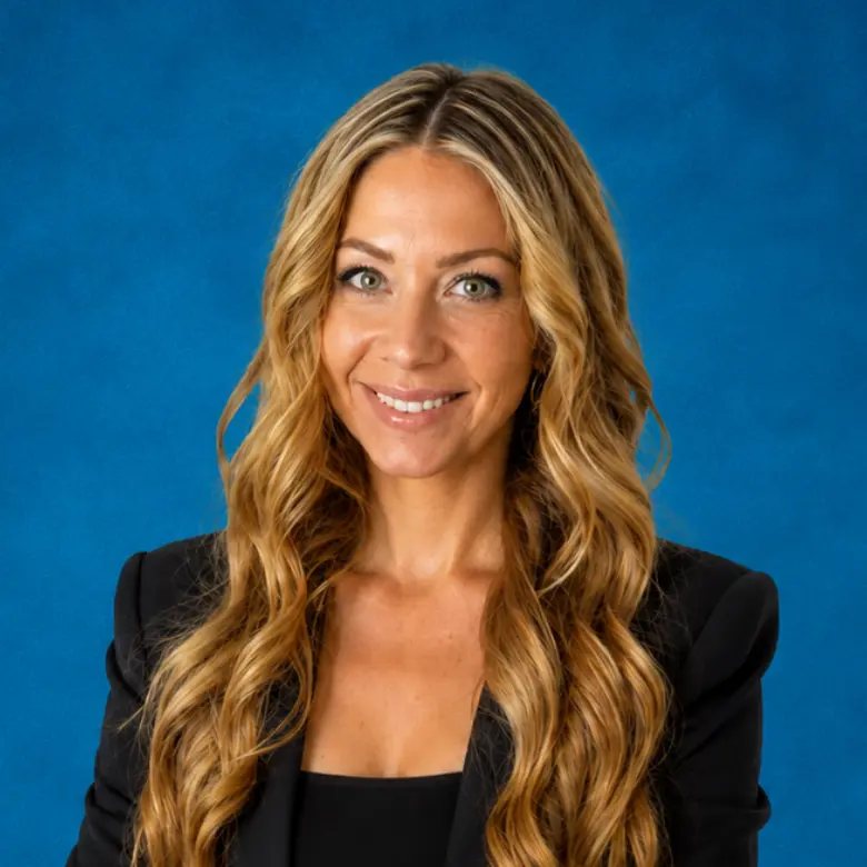 Headshot of Alana Mardakhayev, DNP, FNP-BC with blue background