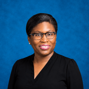Headshot of Alexandra Fleary with blue background
