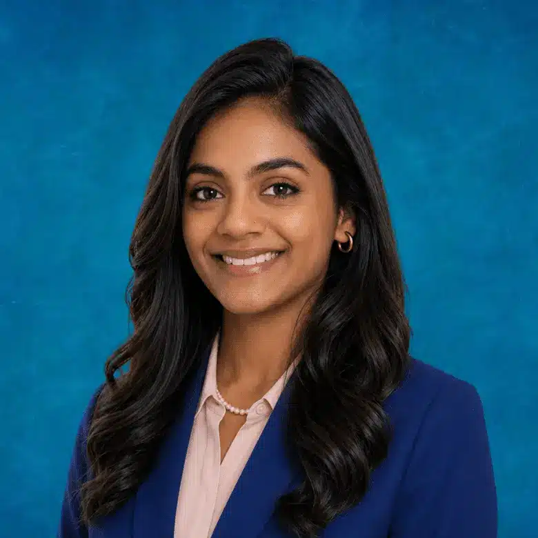 Headshot of Aruna Yedla, MD with blue background