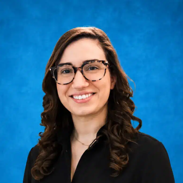 Headshot of Blair Uhlig, CNM with blue background