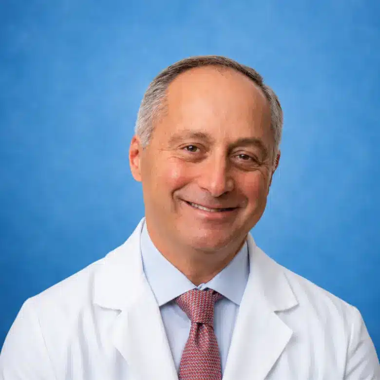Headshot of David M. Kaufman, MD with blue background