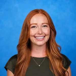 Headshot of Emily Eischen, MD with blue background