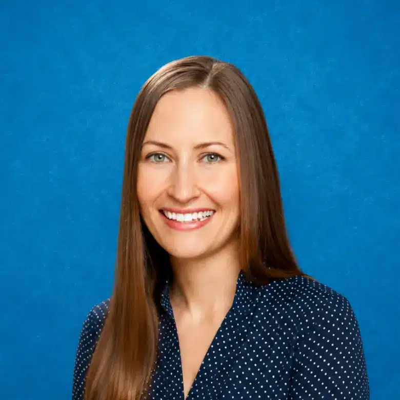 Headshot of Janette Davison, MD with blue background