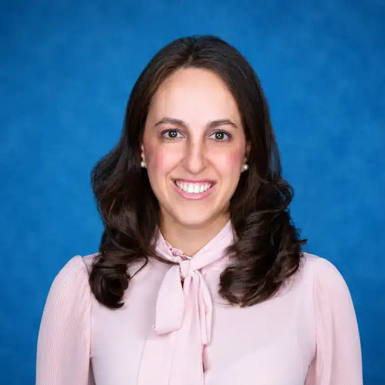 Headshot of Noor Taied, DO with blue background