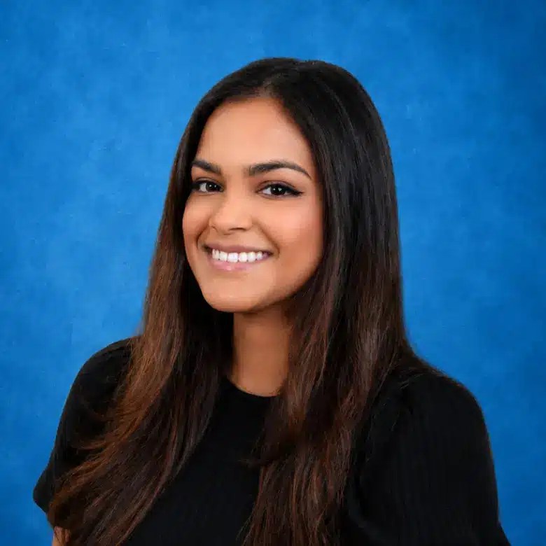 Headshot of Savita Sukha, WHNP with blue background